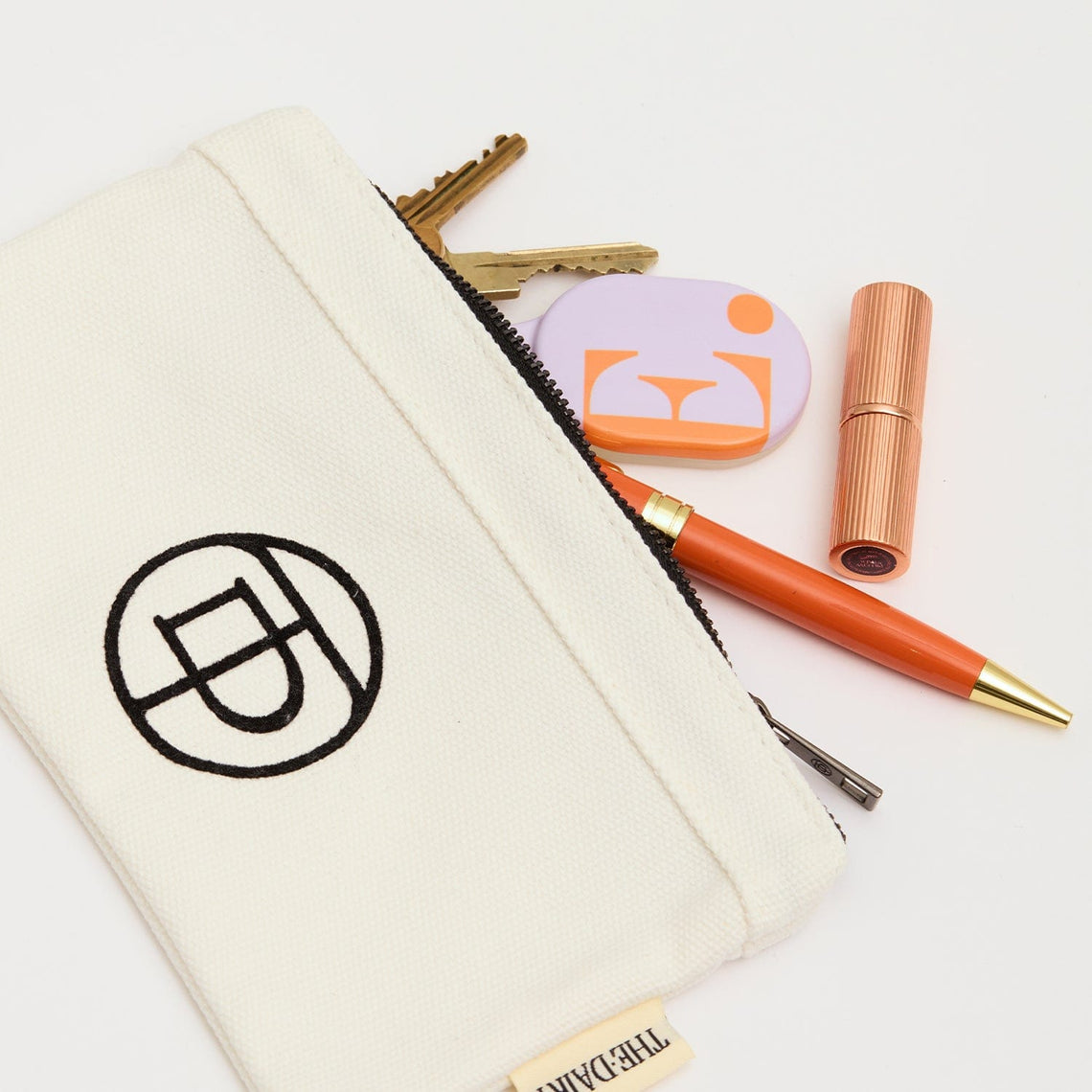 Personalized AirTags from The Dairy collection featuring custom designs for easy tracking and style